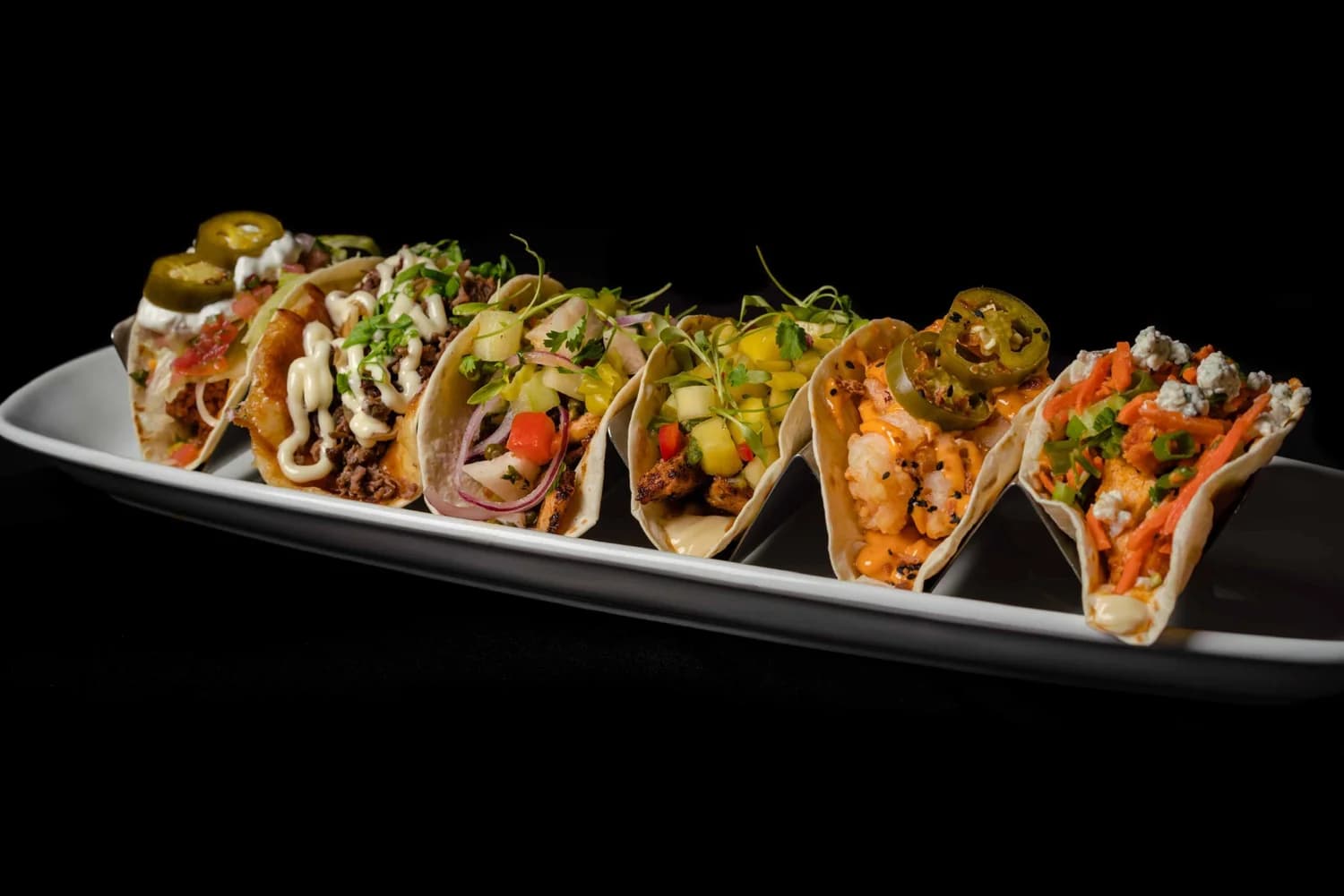 Naked Taco signature tacos served two per order